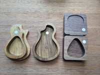 Small guitar shaped and square pick boxes open